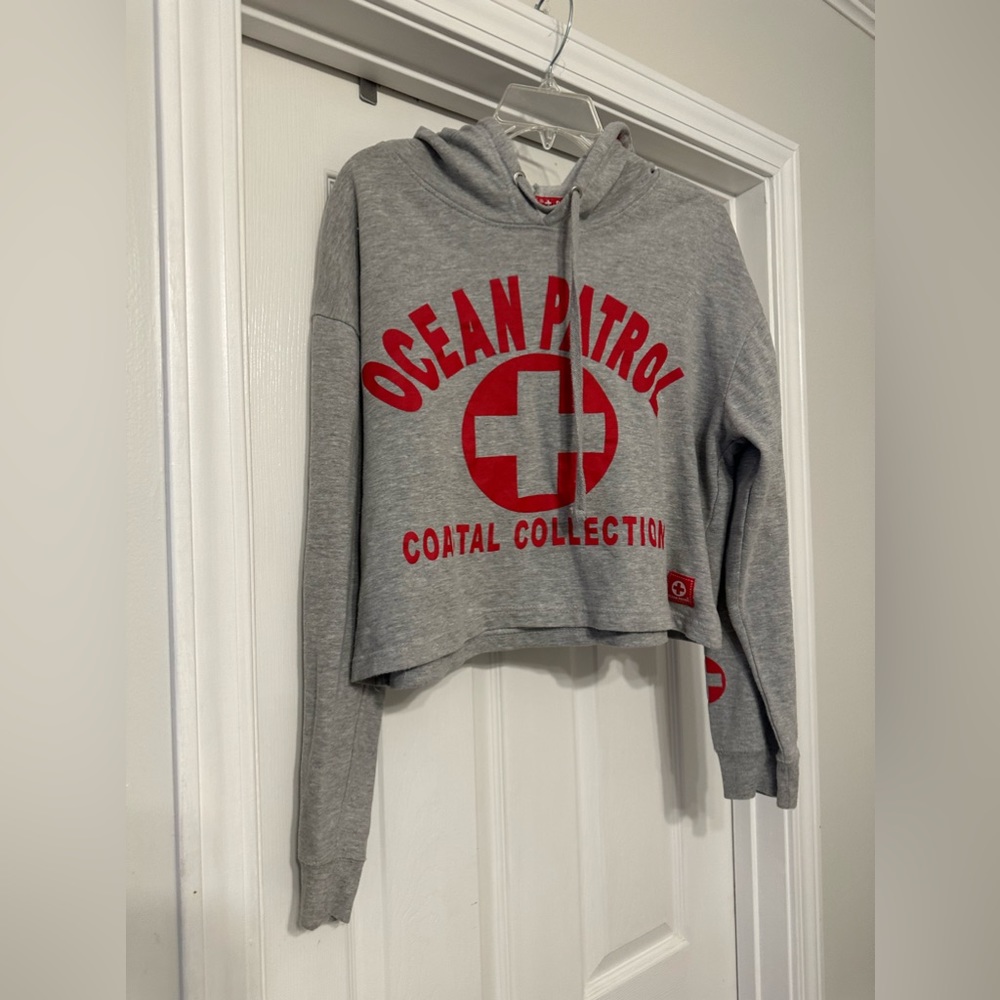 Ocean Patrol Cropped Hoodie is a size Large.